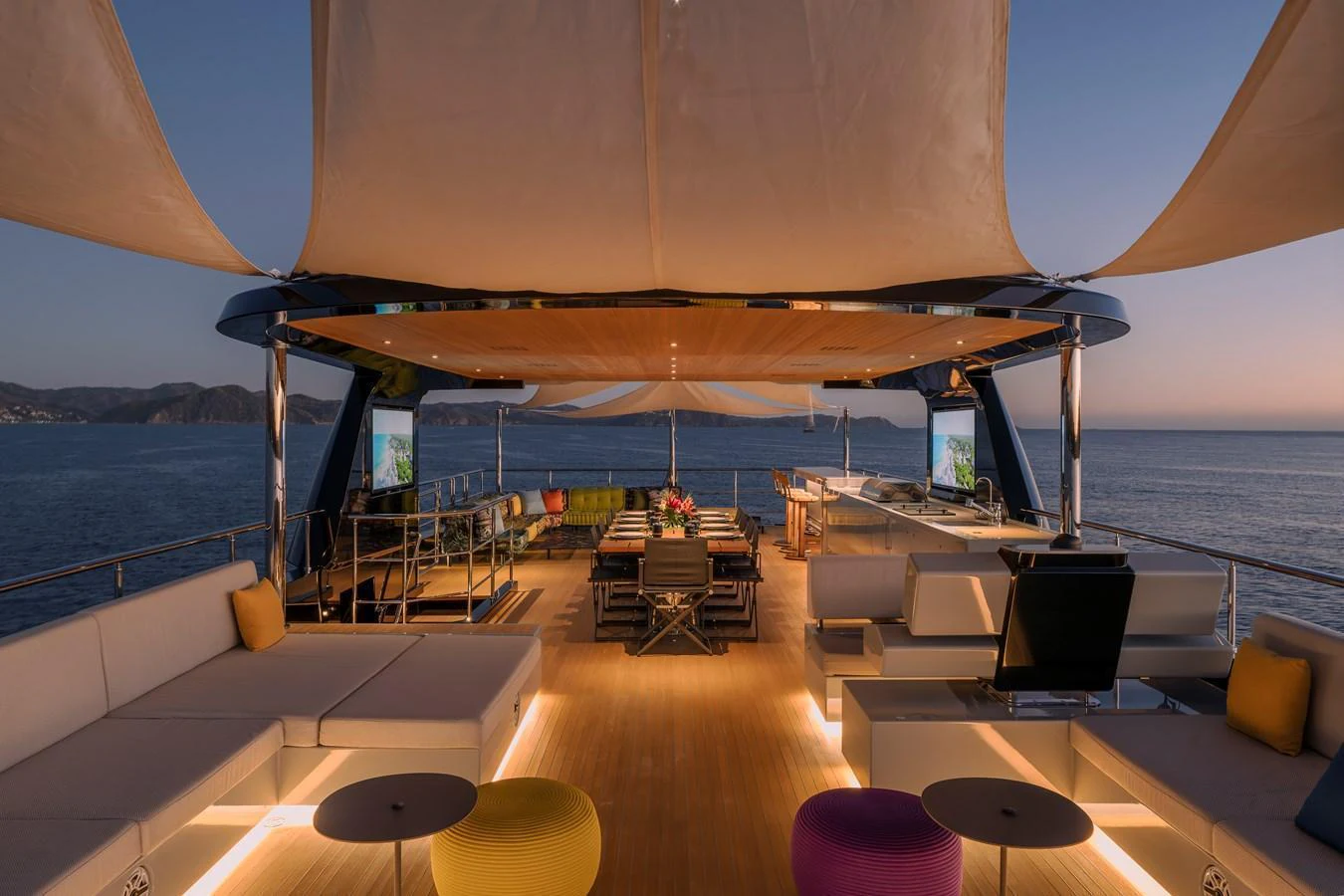 The sundeck offers a luxurious open-air dining and lounging area with stunning ocean views. aboard SPRITZ 116 Yacht for Sale