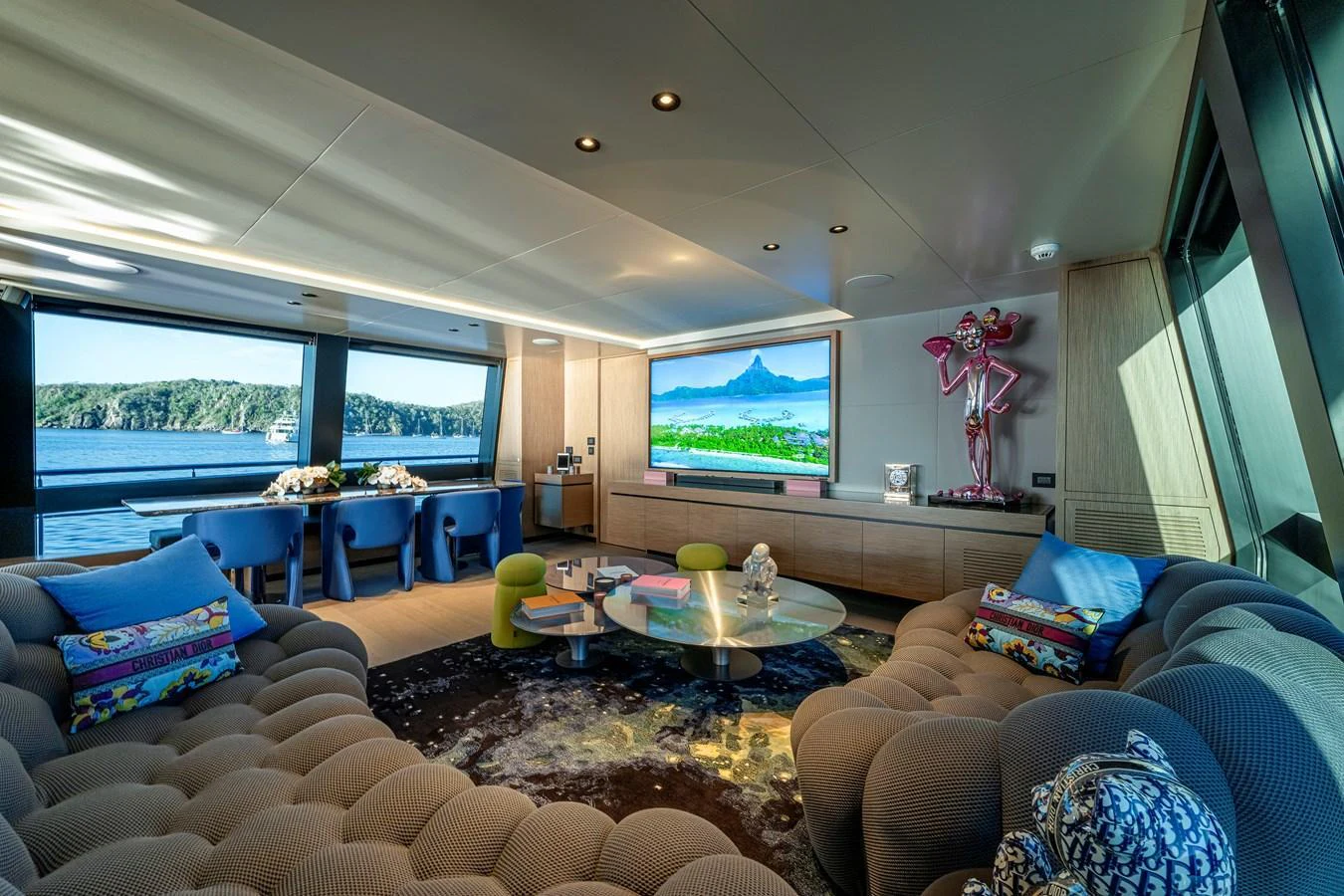 The salon offers a luxurious and comfortable space with panoramic views and stylish decor. aboard SPRITZ 116 Yacht for Sale