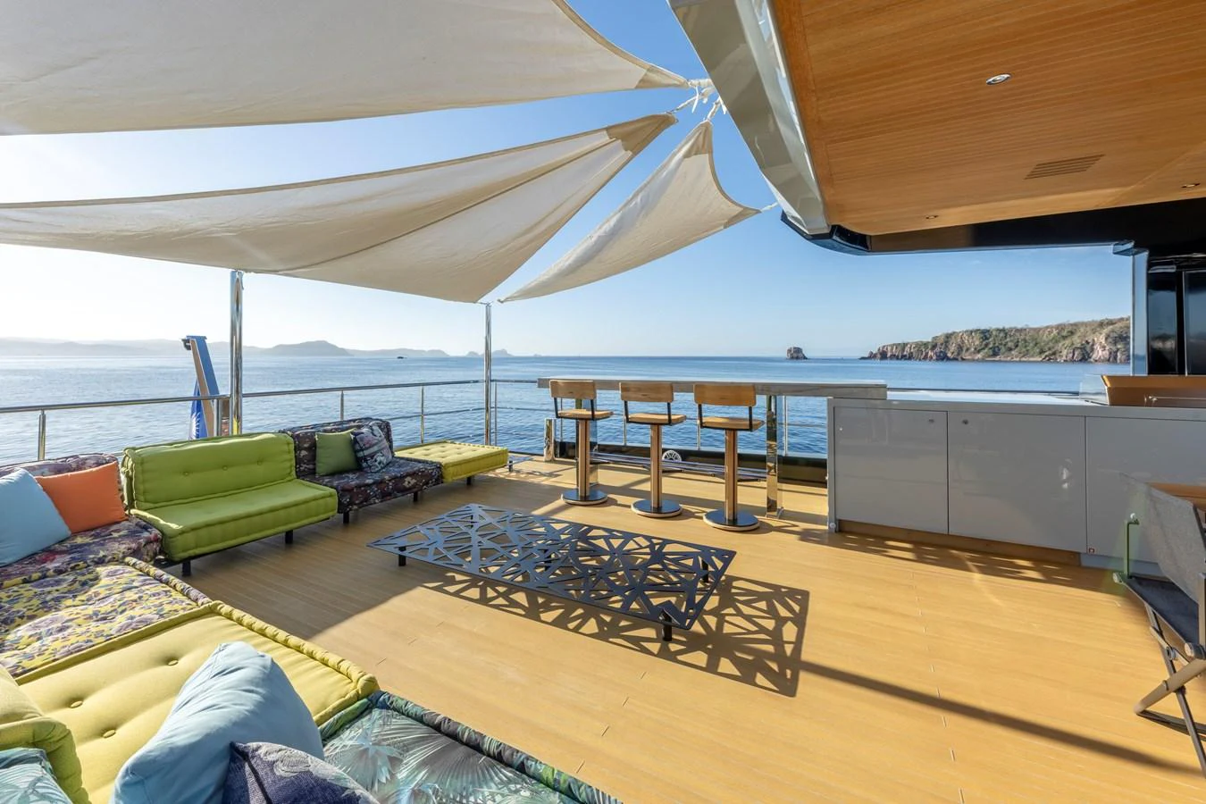The sundeck offers a spacious and stylish area with comfortable seating and a bar, perfect for relaxation and socializing. aboard H2O - SPRITZ 116 Yacht for Sale