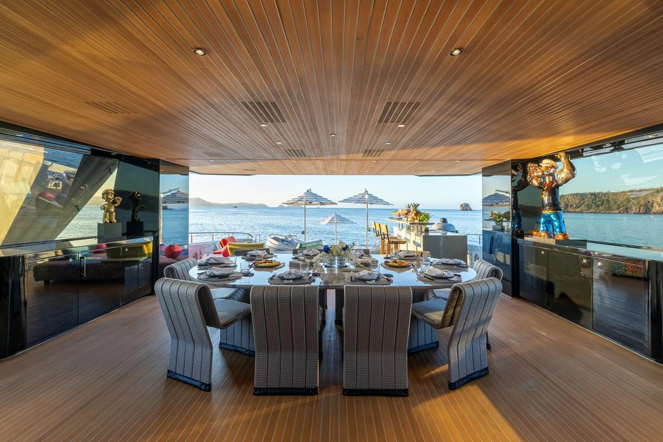 The yacht's dining area offers a luxurious setting with panoramic ocean views and elegant furnishings. aboard H2O - SPRITZ 116 Yacht for Sale