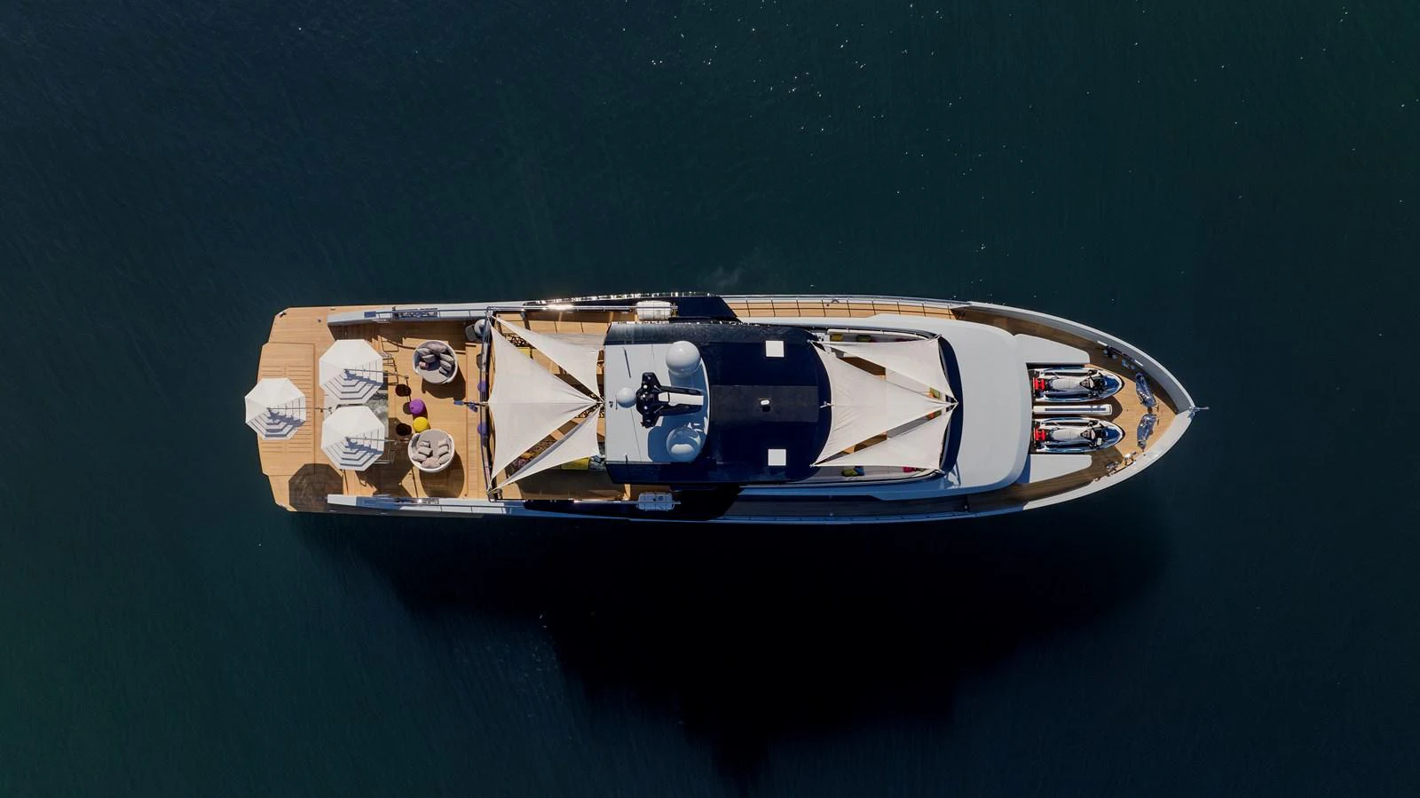 An aerial view of a luxurious yacht showcasing its spacious deck and sleek design. aboard H2O - SPRITZ 116 Yacht for Sale