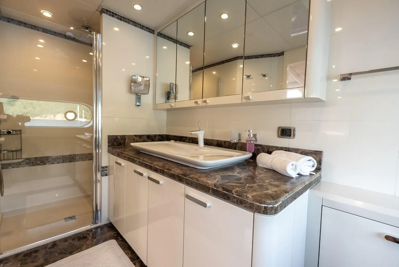 The yacht's bathroom features a sleek design with a spacious countertop and modern fixtures. aboard JAFE TICA Yacht for Sale