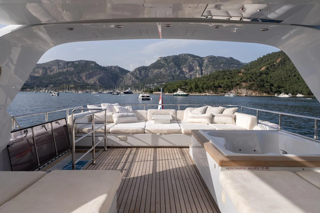 The aft deck offers a luxurious lounging area with plush seating and stunning views of the surrounding waters. aboard JAFE TICA Yacht for Sale