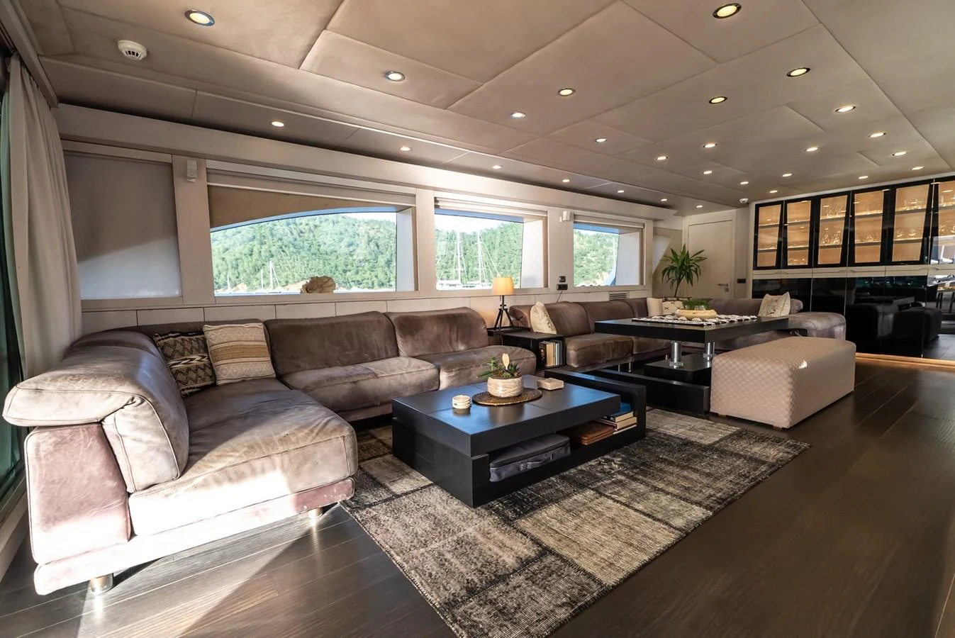 The spacious salon features plush seating and elegant decor, offering a comfortable and stylish retreat. aboard JAFE TICA Yacht for Sale