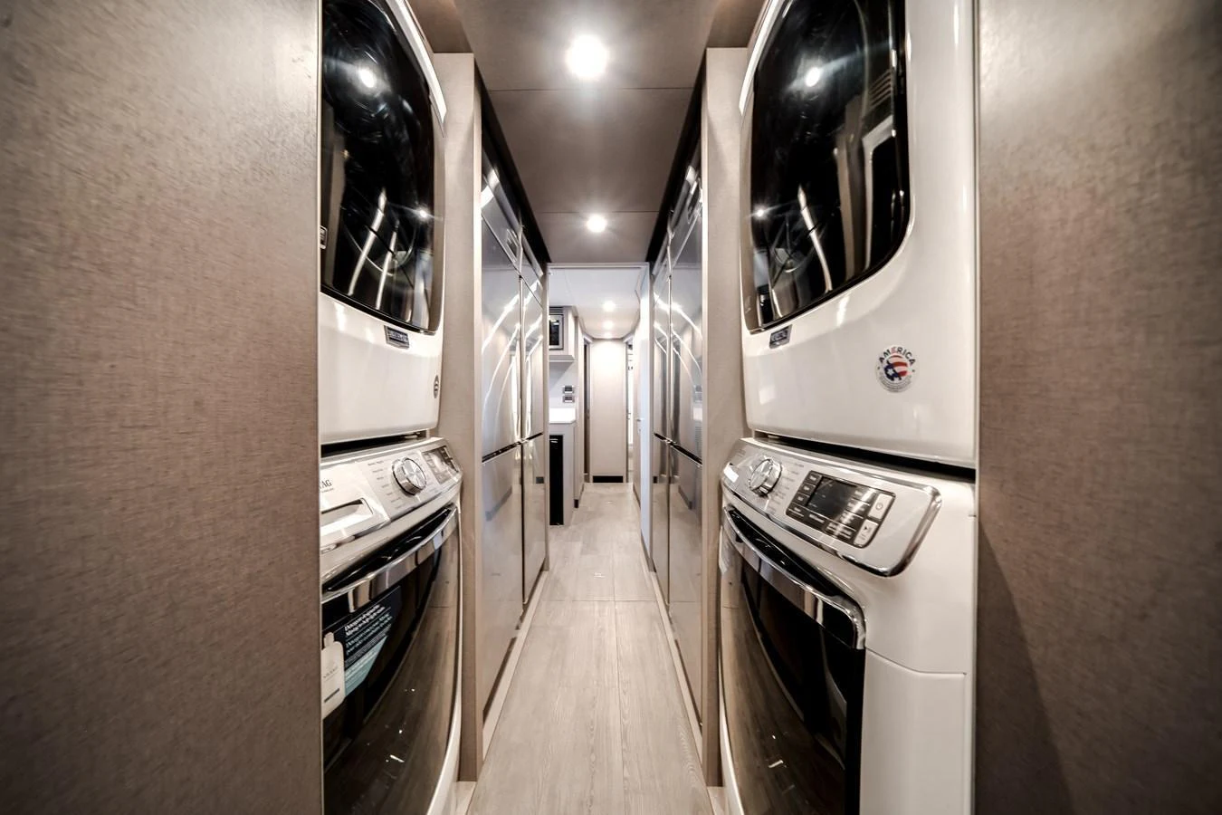 The yacht features a well-equipped laundry room with multiple washers and dryers for convenience. aboard OCEAN ALEXANDER 44G/01 Yacht for Sale