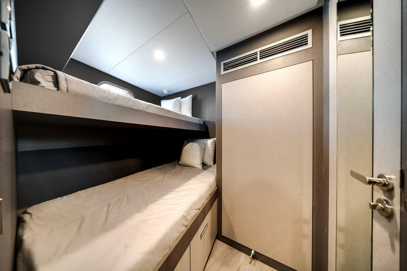 A cozy cabin with bunk beds and modern decor. aboard OCEAN ALEXANDER 44G/01 Yacht for Sale