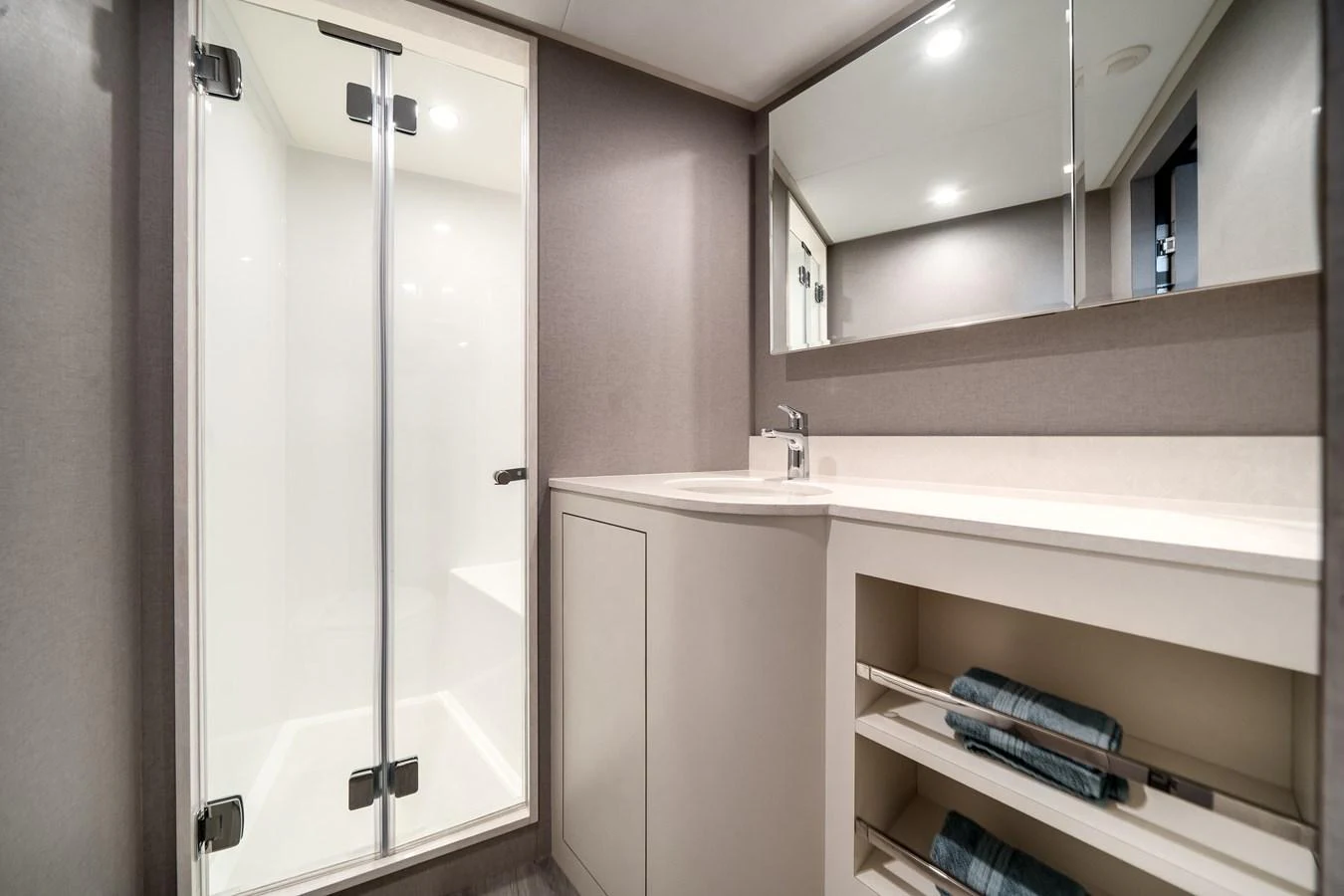 The yacht's bathroom features a sleek design with a spacious shower and modern fixtures. aboard OCEAN ALEXANDER 44G/01 Yacht for Sale