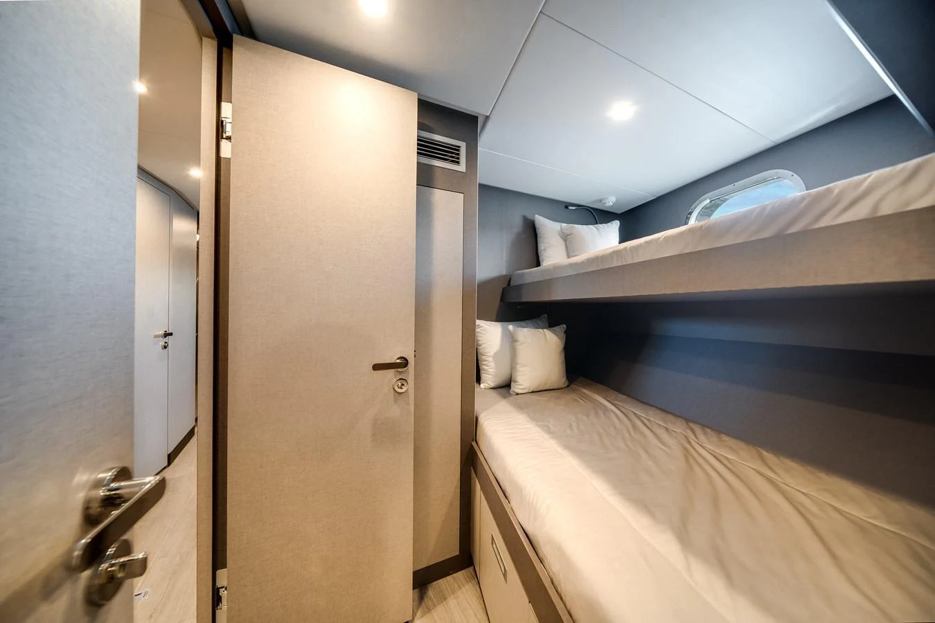 A cozy cabin with bunk beds and modern lighting. aboard OCEAN ALEXANDER 44G/01 Yacht for Sale