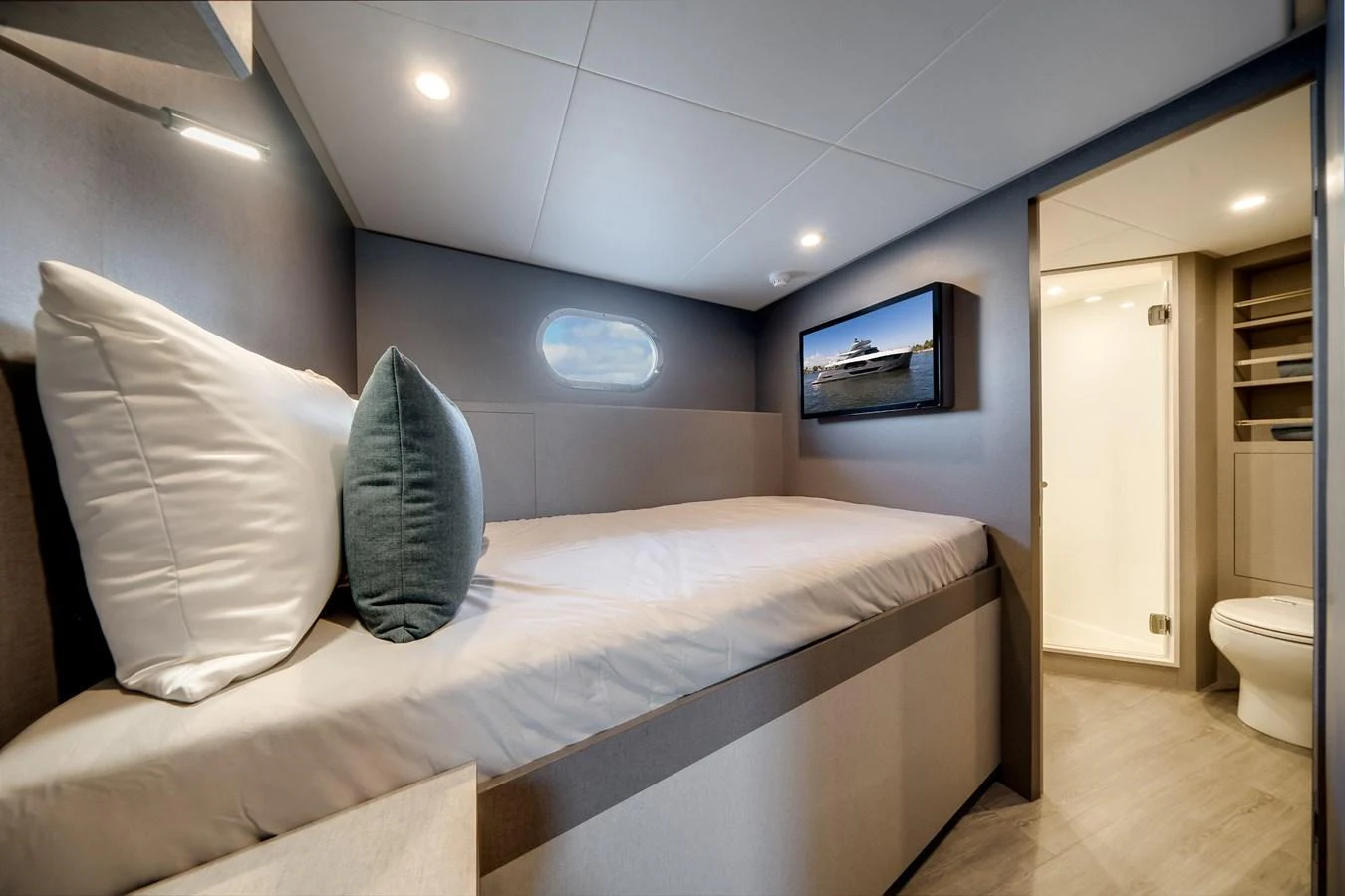 The guest cabin offers a cozy and modern sleeping area with an ensuite bathroom. aboard OCEAN ALEXANDER 44G/01 Yacht for Sale