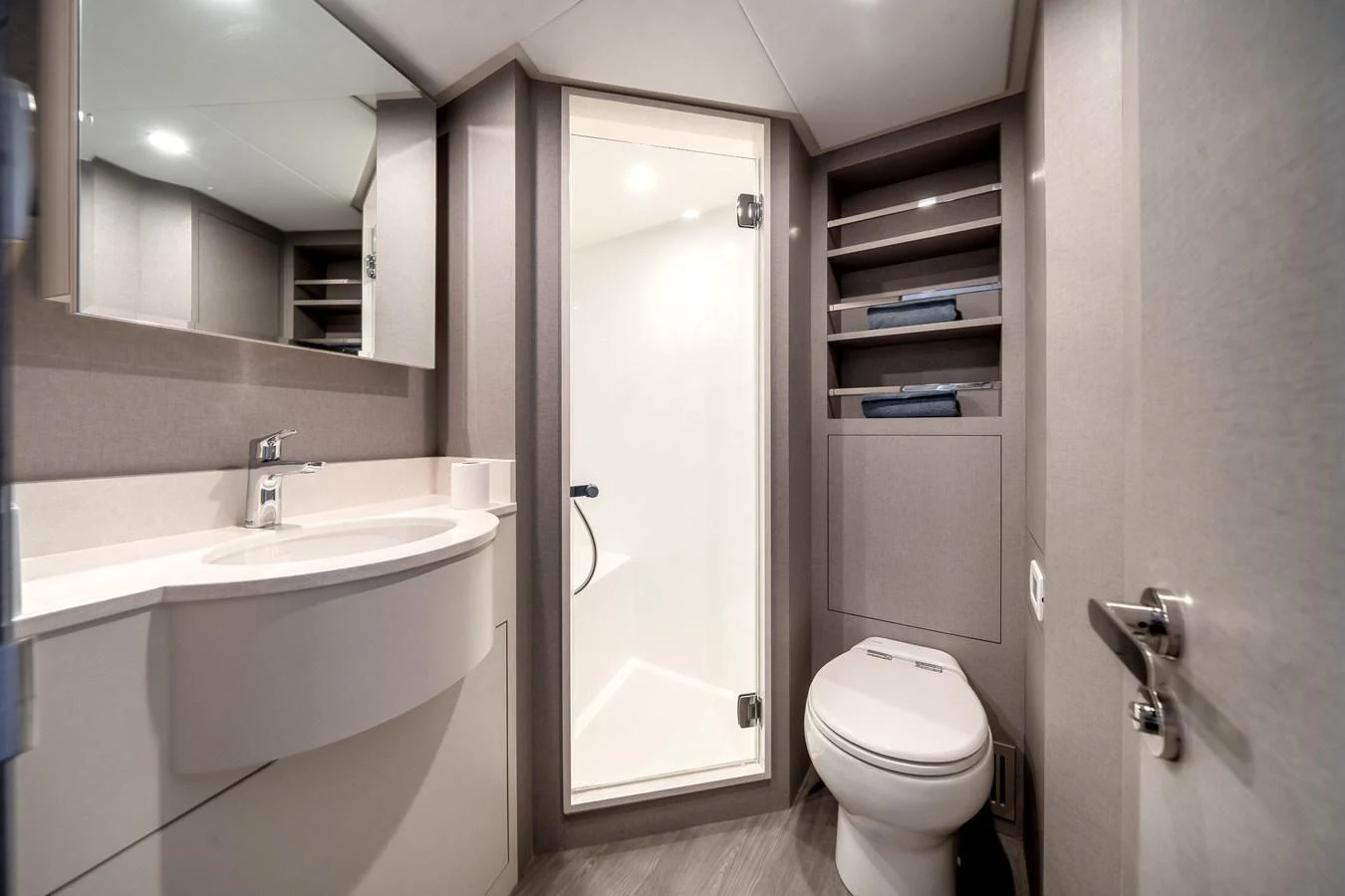 A sleek and modern yacht bathroom with a spacious shower and elegant fixtures. aboard OCEAN ALEXANDER 44G/01 Yacht for Sale
