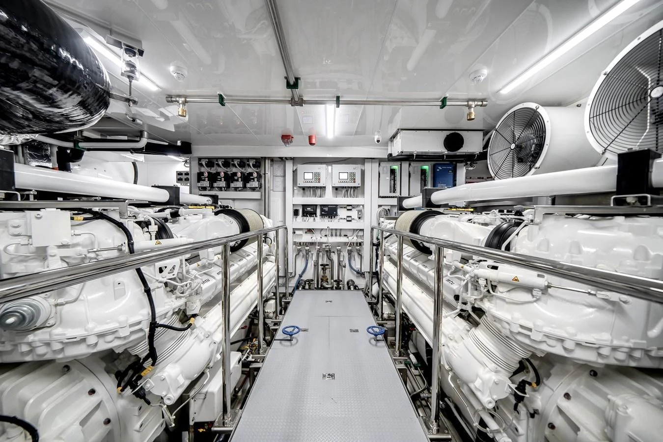 The yacht's engine room showcases a pristine and well-organized mechanical space. aboard OCEAN ALEXANDER 44G/01 Yacht for Sale