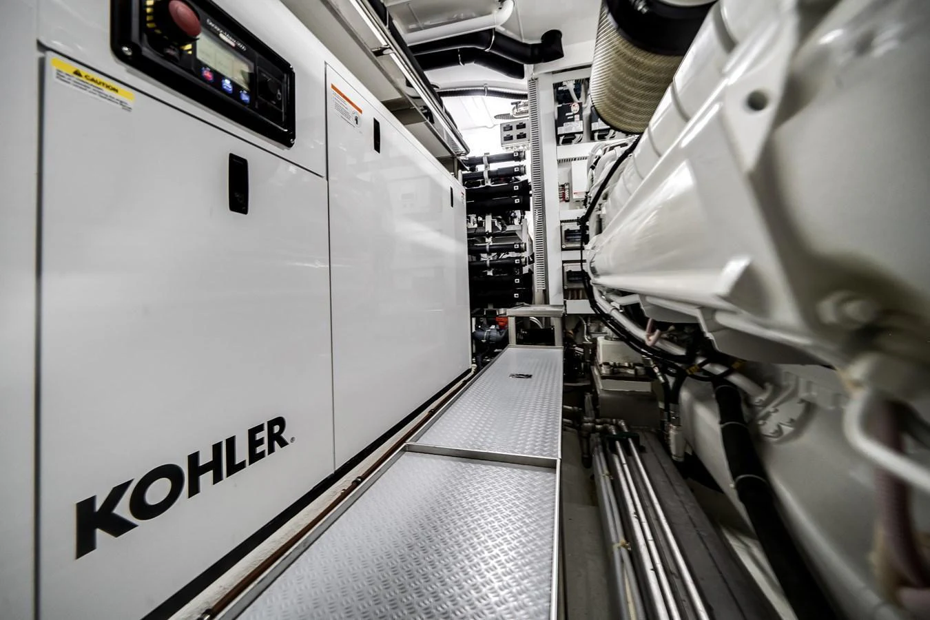 The image showcases the yacht's engine room with high-quality machinery and equipment. aboard OCEAN ALEXANDER 44G/01 Yacht for Sale