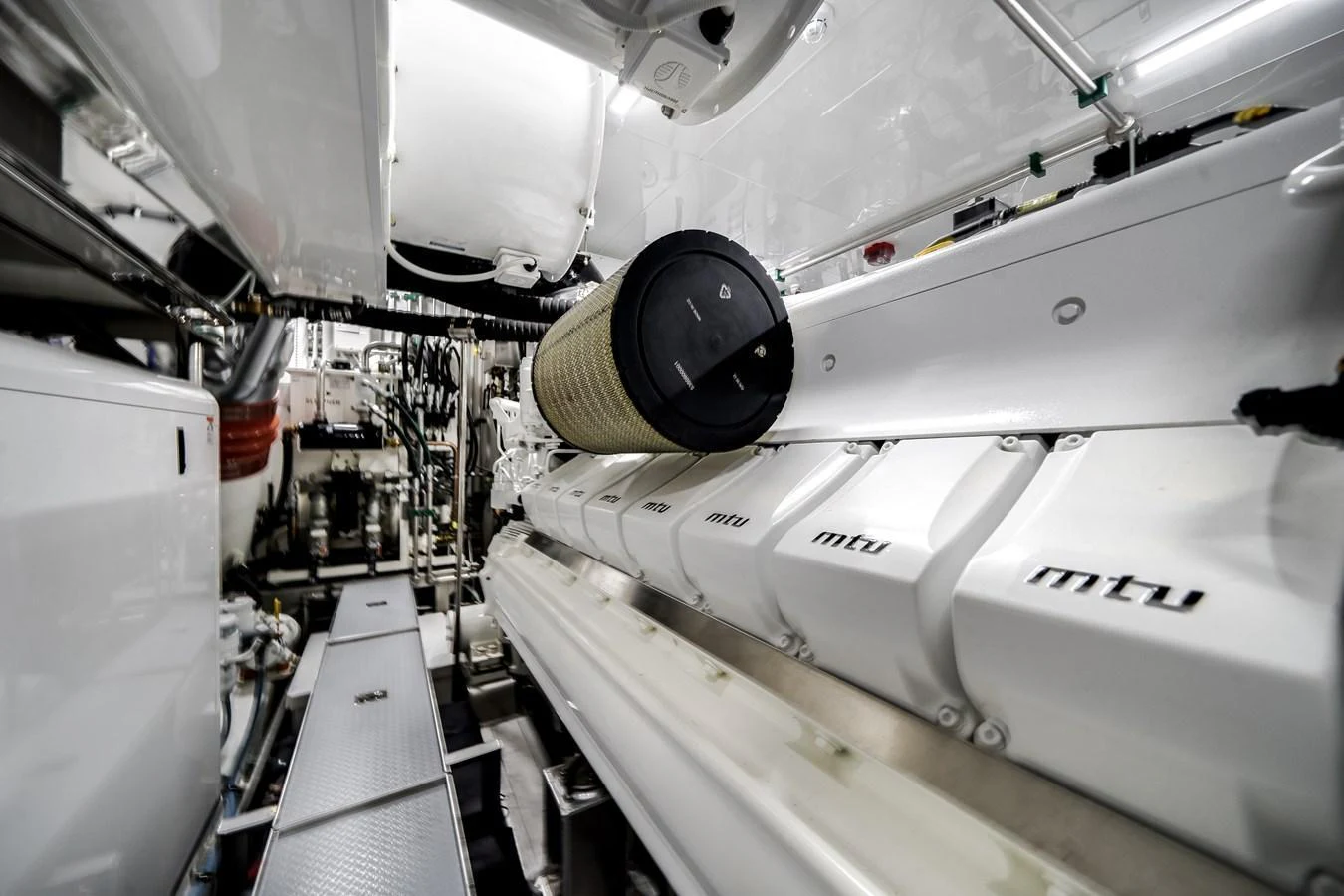 The engine room showcases powerful MTU engines and a meticulously organized layout. aboard OCEAN ALEXANDER 44G/01 Yacht for Sale