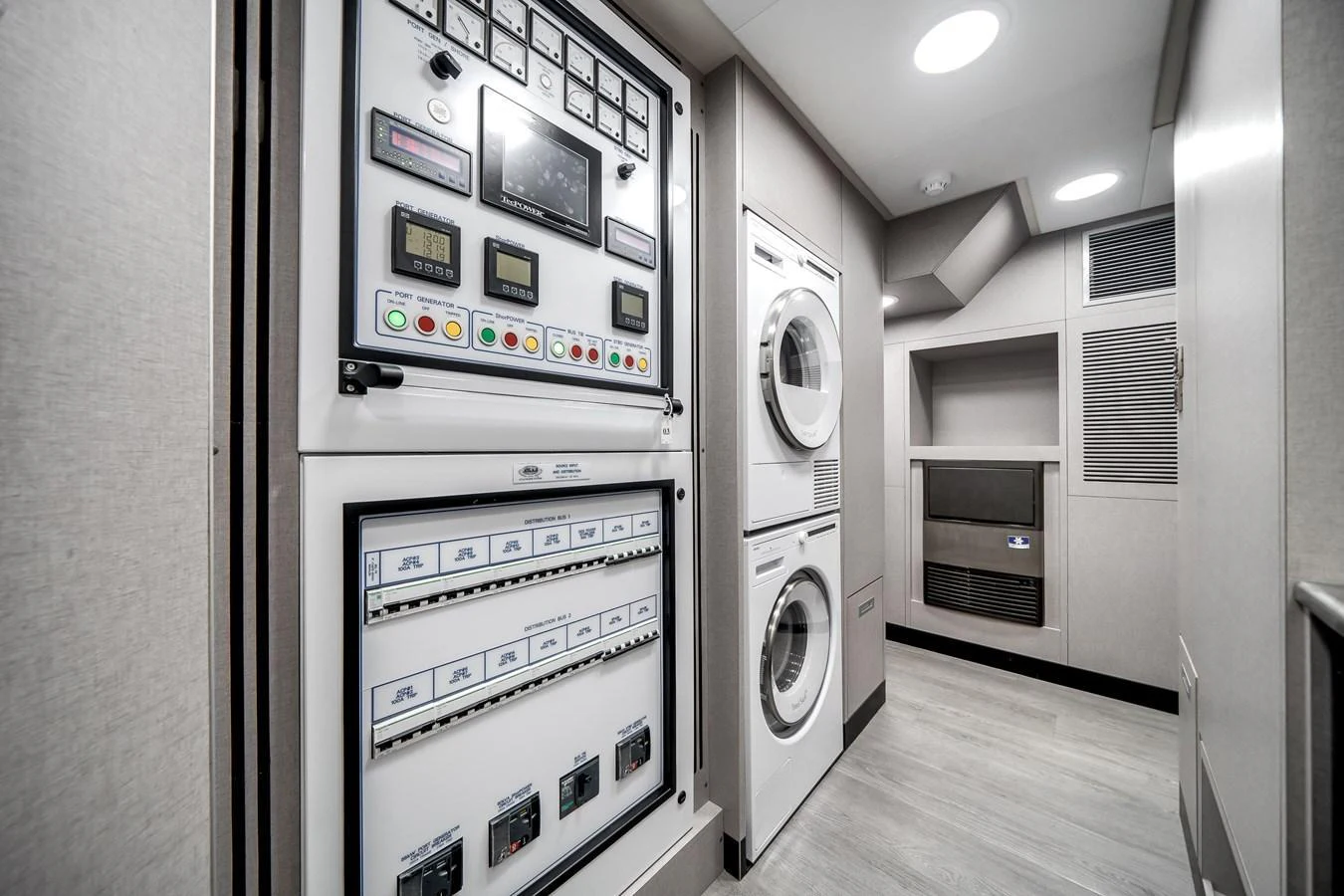 The yacht's laundry room is equipped with modern appliances and control panels for efficient onboard management. aboard OCEAN ALEXANDER 44G/01 Yacht for Sale