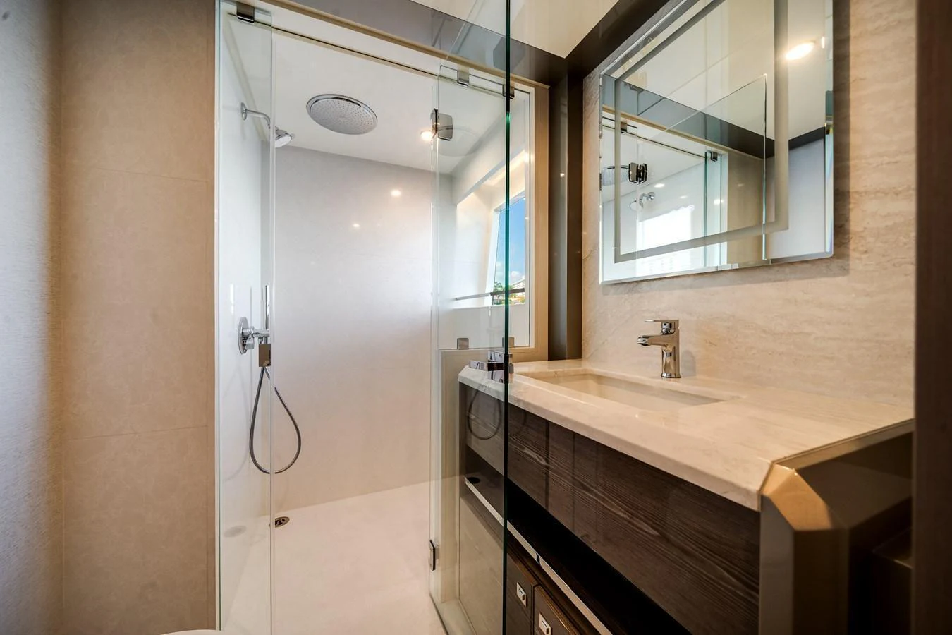 The yacht's bathroom features a sleek, modern design with a spacious shower and elegant fixtures. aboard OCEAN ALEXANDER 44G/01 Yacht for Sale