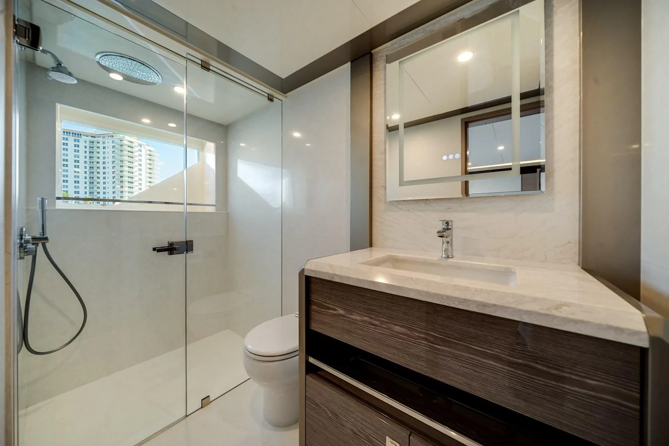 The yacht's bathroom features a modern design with a spacious shower and sleek fixtures. aboard OCEAN ALEXANDER 44G/01 Yacht for Sale