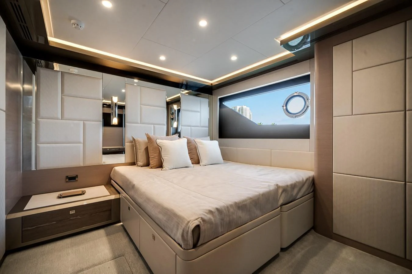 The stateroom features a luxurious bed with elegant decor and ample natural light. aboard OCEAN ALEXANDER 44G/01 Yacht for Sale