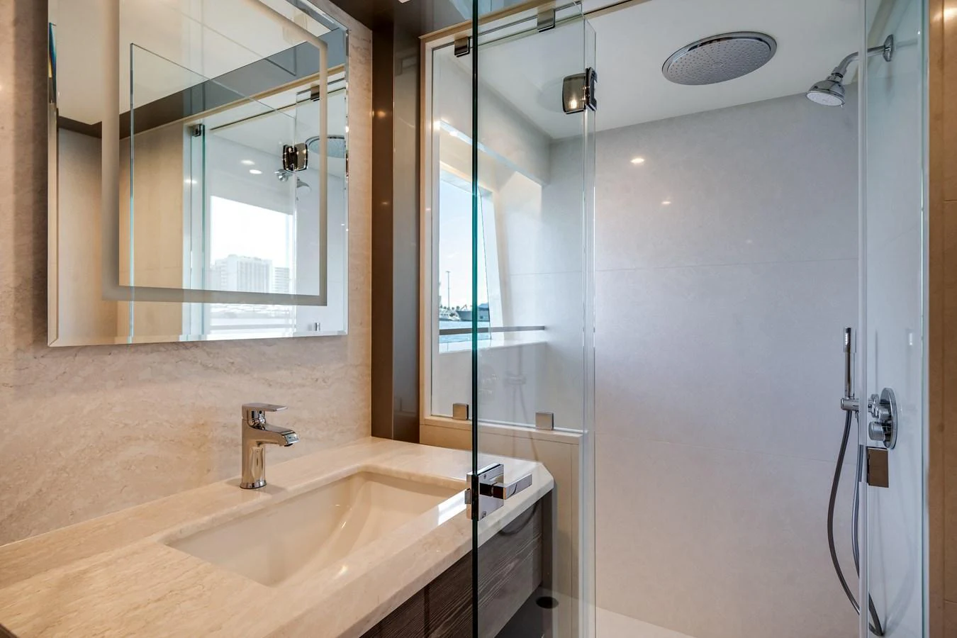 The yacht's bathroom features a sleek design with a spacious shower and modern fixtures. aboard OCEAN ALEXANDER 44G/01 Yacht for Sale