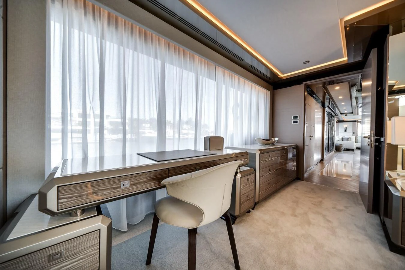 The yacht's office space is elegantly designed with modern furnishings and ample natural light. aboard OCEAN ALEXANDER 44G/01 Yacht for Sale