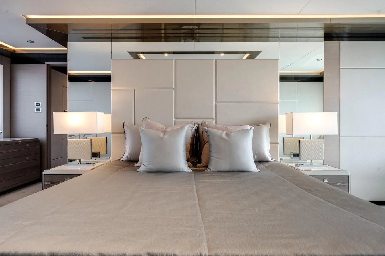 The master stateroom features a luxurious bed with plush pillows and modern lighting. aboard OCEAN ALEXANDER 44G/01 Yacht for Sale