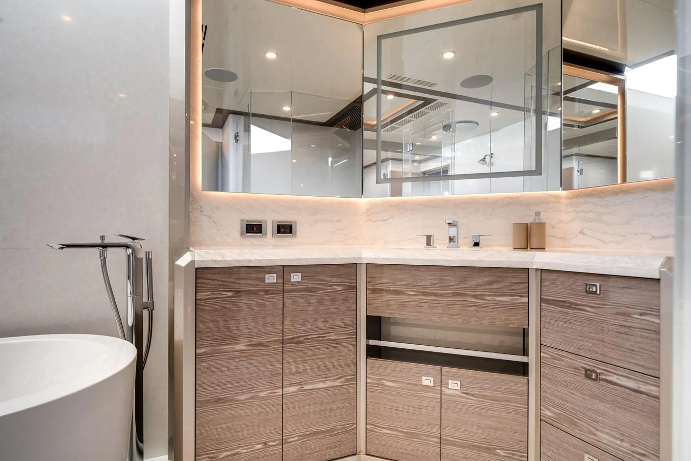 The yacht's bathroom features modern fixtures and elegant cabinetry, creating a luxurious and serene space. aboard OCEAN ALEXANDER 44G/01 Yacht for Sale