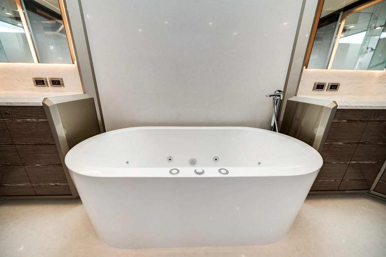 A luxurious bathroom featuring a modern freestanding bathtub. aboard OCEAN ALEXANDER 44G/01 Yacht for Sale
