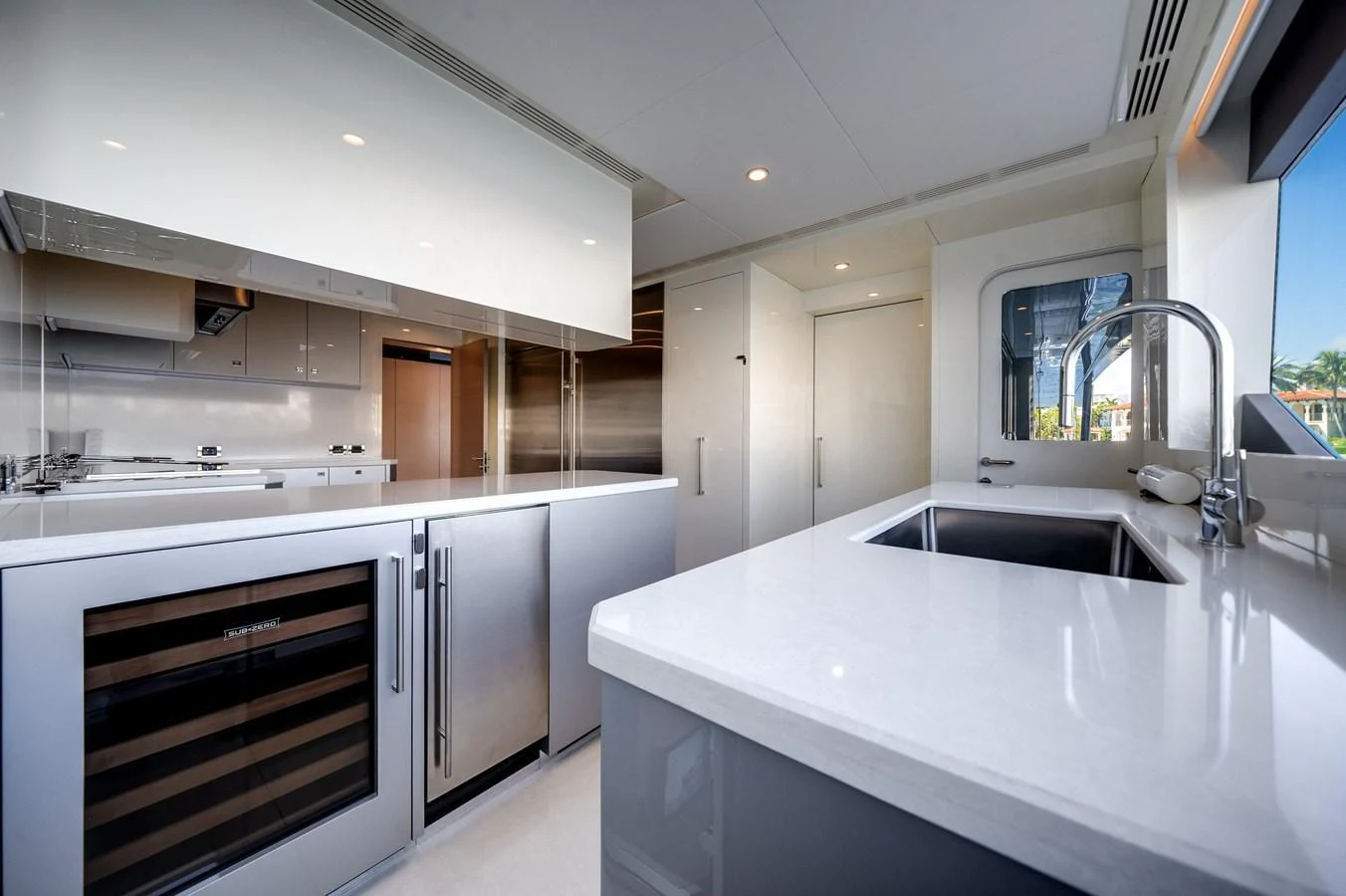 The yacht's galley features sleek, modern appliances and ample counter space, perfect for gourmet cooking. aboard OCEAN ALEXANDER 44G/01 Yacht for Sale