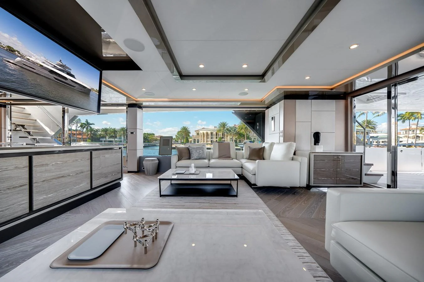 The spacious salon features modern furnishings and large windows offering stunning views. aboard OCEAN ALEXANDER 44G/01 Yacht for Sale