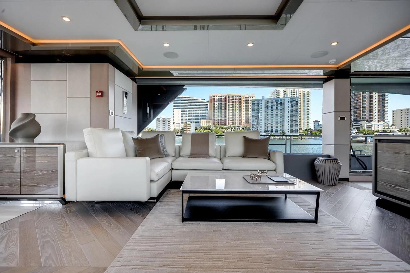 The yacht's salon features a luxurious seating area with modern furnishings and a stunning view of the waterfront. aboard OCEAN ALEXANDER 44G/01 Yacht for Sale