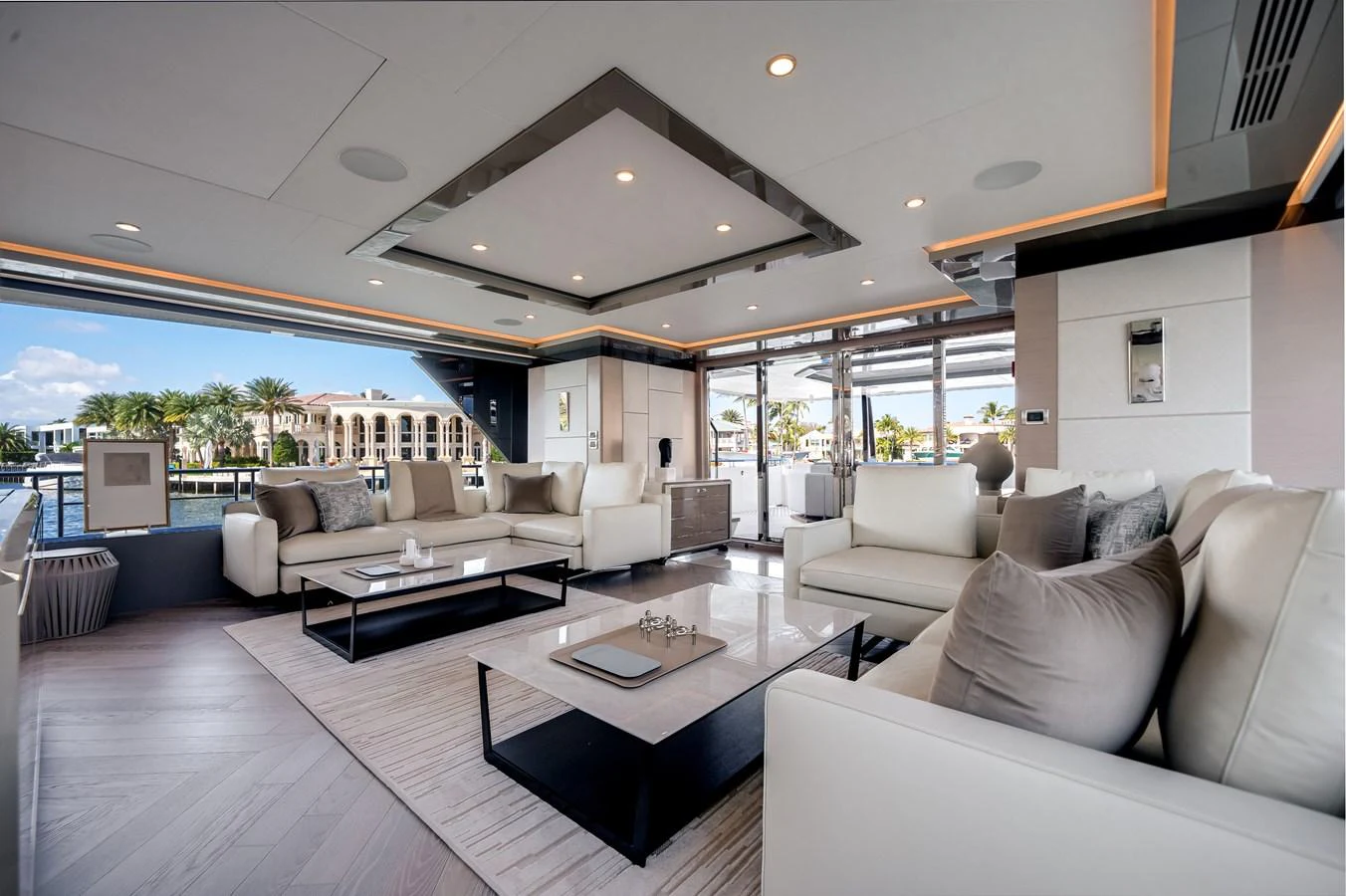 The yacht's salon features luxurious seating with panoramic views and modern decor. aboard OCEAN ALEXANDER 44G/01 Yacht for Sale