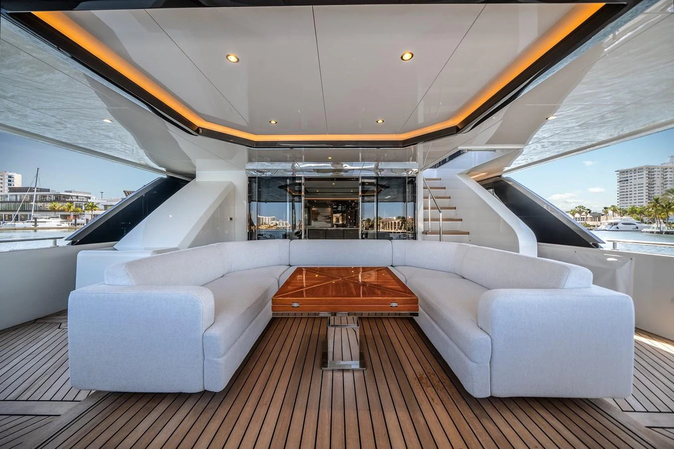 The aft deck features a spacious seating area with a large, elegant table, perfect for social gatherings. aboard OCEAN ALEXANDER 44G/01 Yacht for Sale