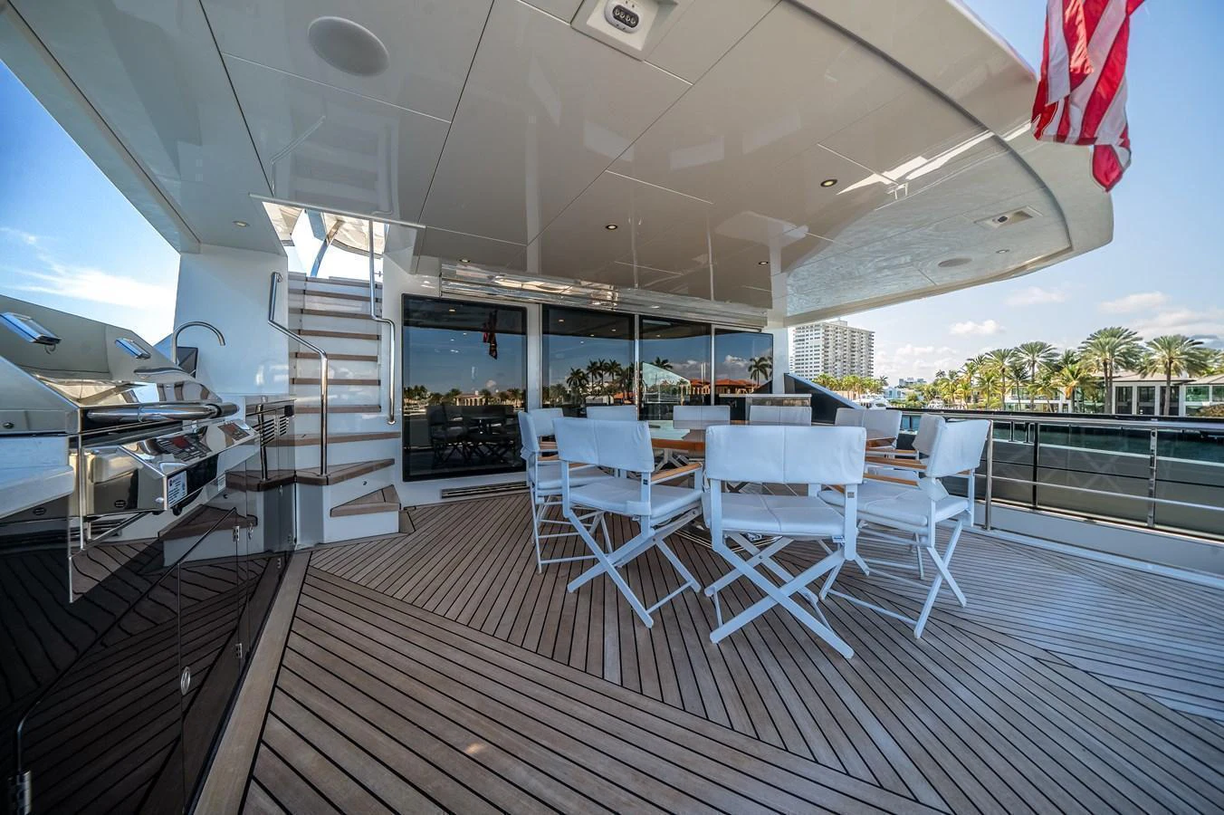The aft deck features a spacious seating area with a dining table and chairs, perfect for alfresco dining. aboard OCEAN ALEXANDER 44G/01 Yacht for Sale