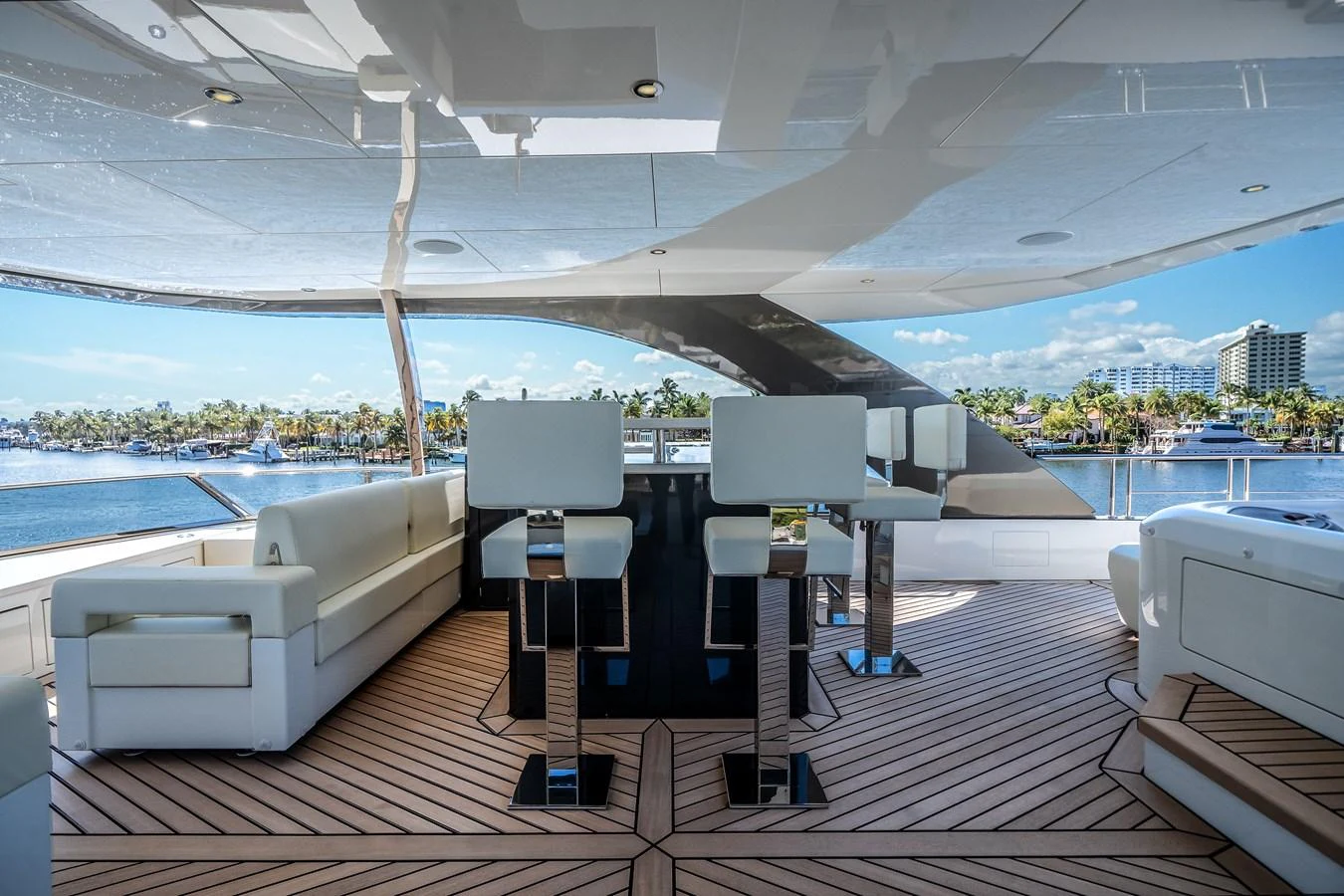 The aft deck features luxurious seating and a stylish bar area with a stunning view of the water. aboard OCEAN ALEXANDER 44G/01 Yacht for Sale