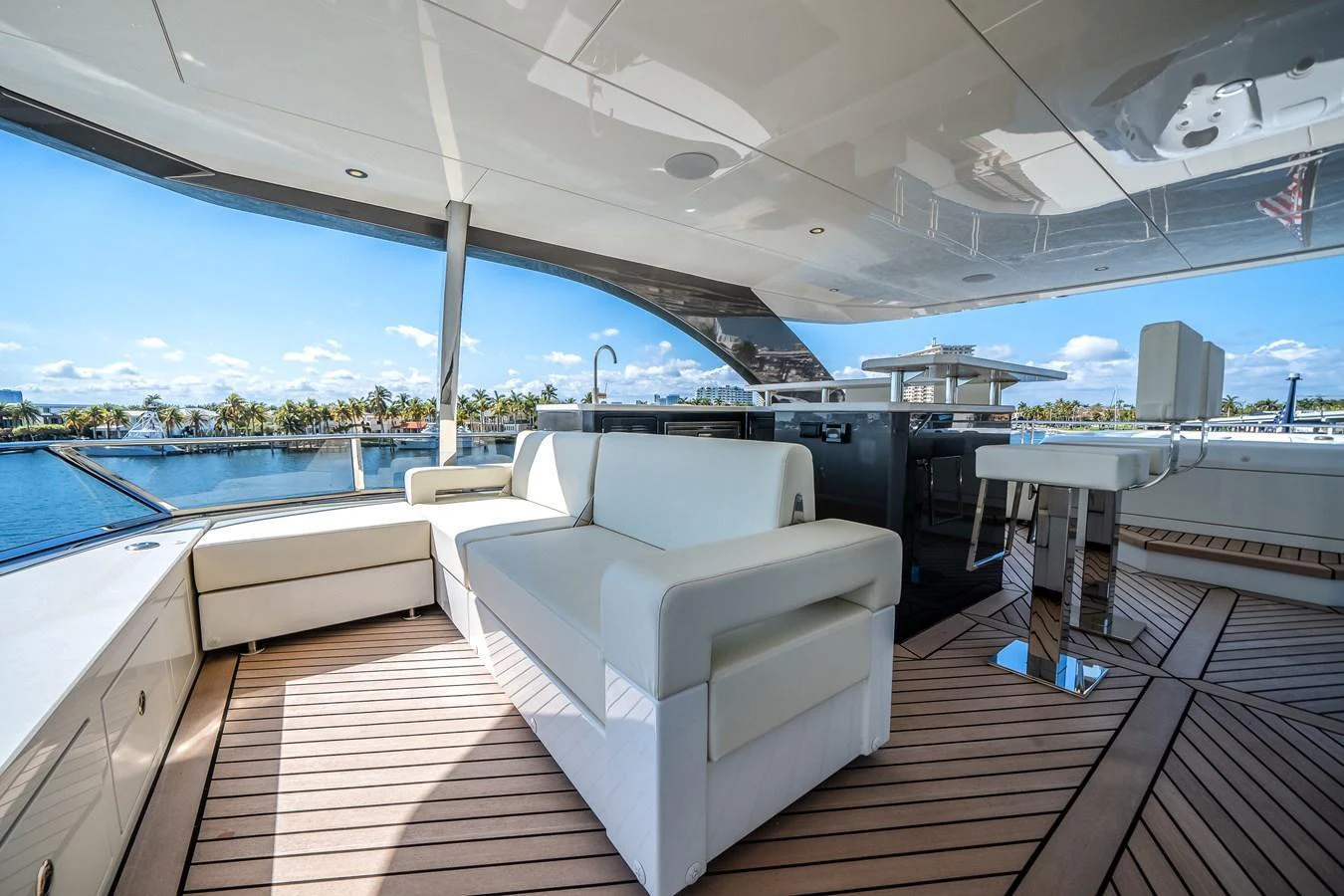 The flybridge offers a spacious and luxurious outdoor seating area with stunning views. aboard OCEAN ALEXANDER 44G/01 Yacht for Sale