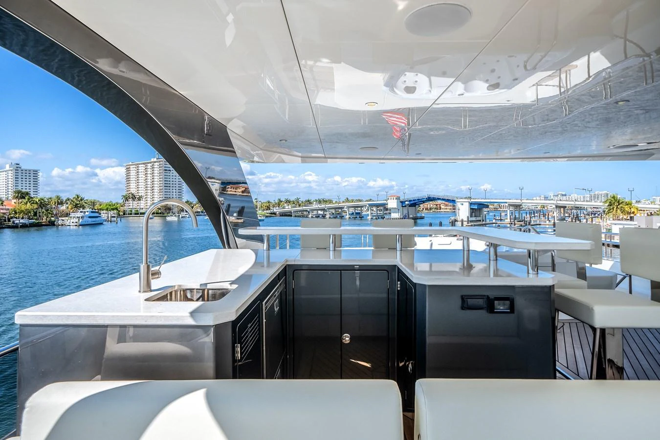 The flybridge offers a luxurious outdoor space with a wet bar and stunning views. aboard OCEAN ALEXANDER 44G/01 Yacht for Sale