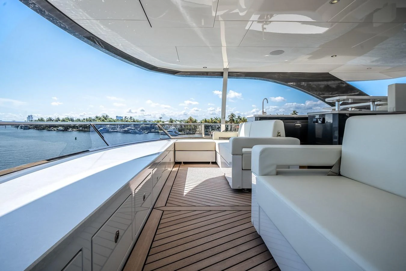 The flybridge offers a spacious and luxurious outdoor seating area with stunning views. aboard OCEAN ALEXANDER 44G/01 Yacht for Sale