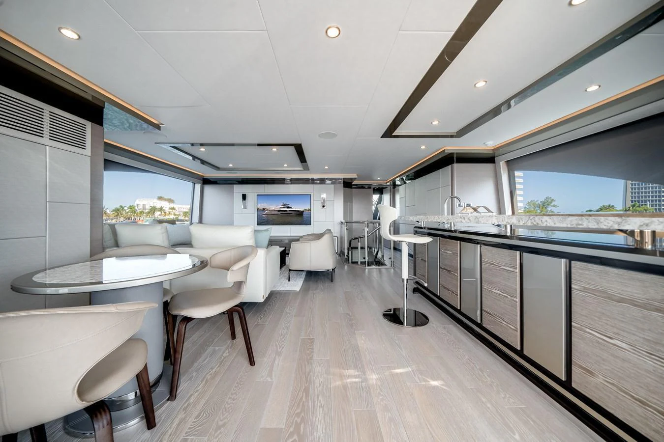 The salon features a spacious and modern design with ample seating and a sleek bar area. aboard OCEAN ALEXANDER 44G/01 Yacht for Sale