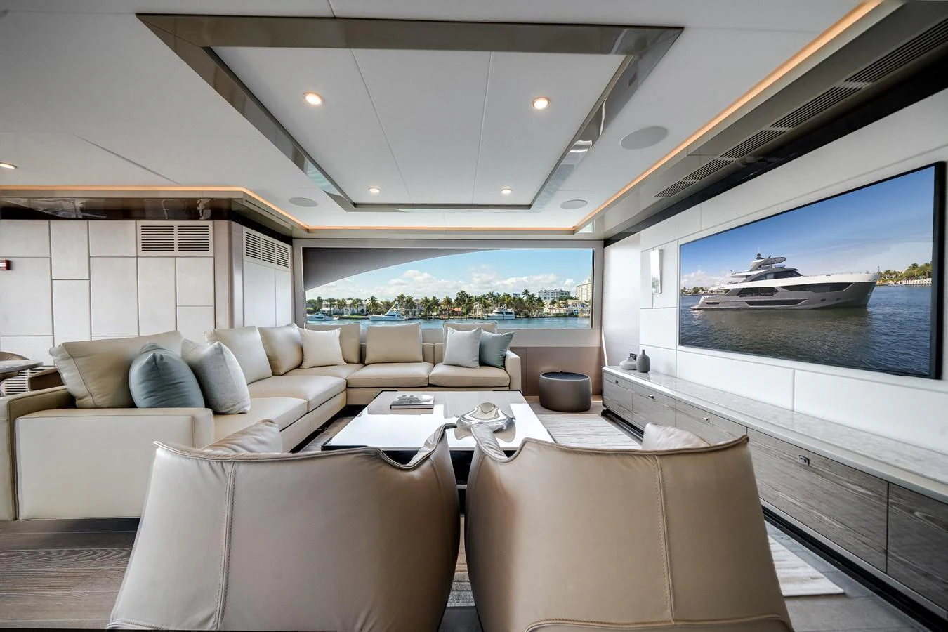 The salon offers a spacious and luxurious seating area with a large TV and panoramic views. aboard OCEAN ALEXANDER 44G/01 Yacht for Sale