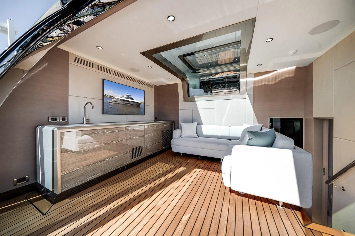 The salon features a modern design with a comfortable seating area and a large flat-screen TV. aboard OCEAN ALEXANDER 44G/01 Yacht for Sale