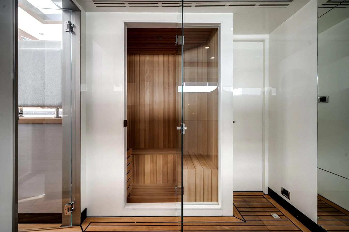 The yacht features a luxurious sauna with wooden interiors and glass doors. aboard OCEAN ALEXANDER 44G/01 Yacht for Sale