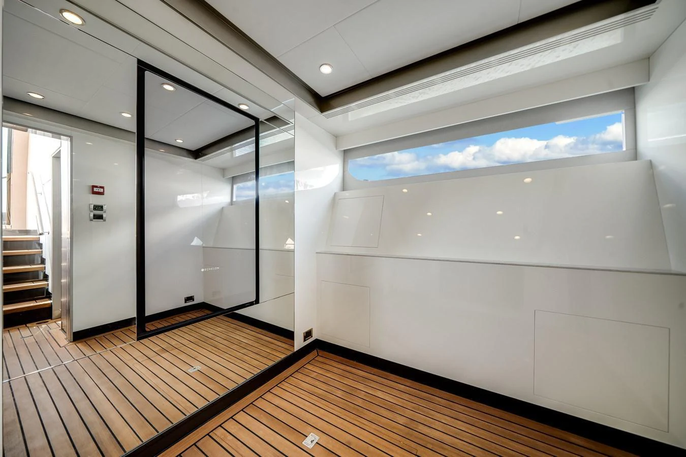 A sleek and modern interior space with wooden flooring and ample natural light. aboard OCEAN ALEXANDER 44G/01 Yacht for Sale
