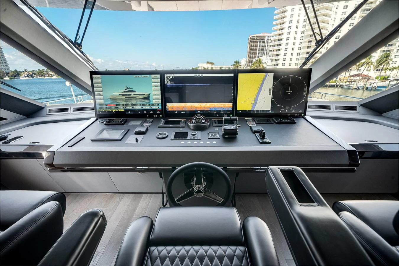 The helm station features advanced navigation equipment and luxurious seating with a panoramic view. aboard OCEAN ALEXANDER 44G/01 Yacht for Sale