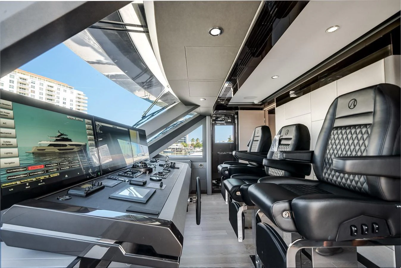 The helm station features advanced navigation systems and luxurious seating, offering a commanding view for the captain. aboard OCEAN ALEXANDER 44G/01 Yacht for Sale