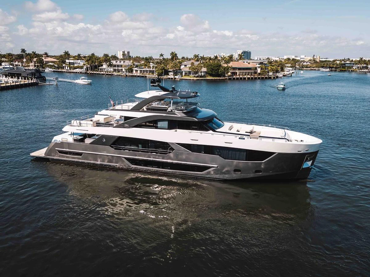 A sleek and modern yacht glides gracefully on calm waters with a scenic coastal backdrop. aboard OCEAN ALEXANDER 44G/01 Yacht for Sale