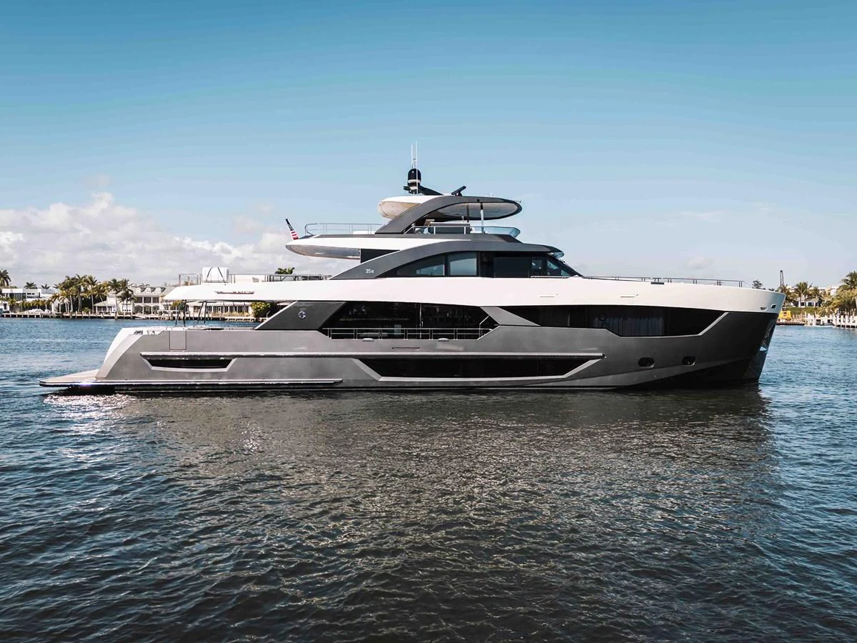 A sleek and modern yacht glides gracefully on calm waters under a clear sky. aboard OCEAN ALEXANDER 44G/01 Yacht for Sale
