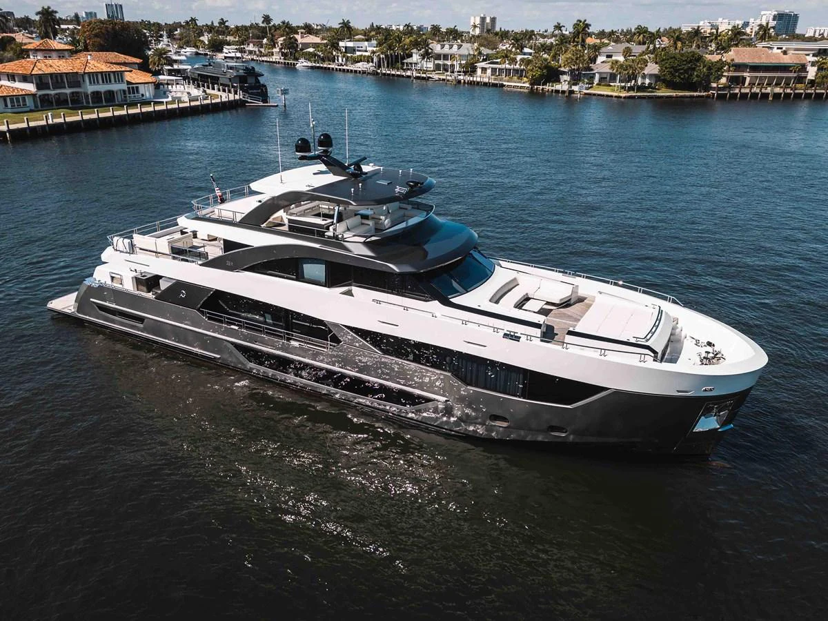 A luxurious yacht cruising through a serene waterfront neighborhood. aboard OCEAN ALEXANDER 44G/01 Yacht for Sale