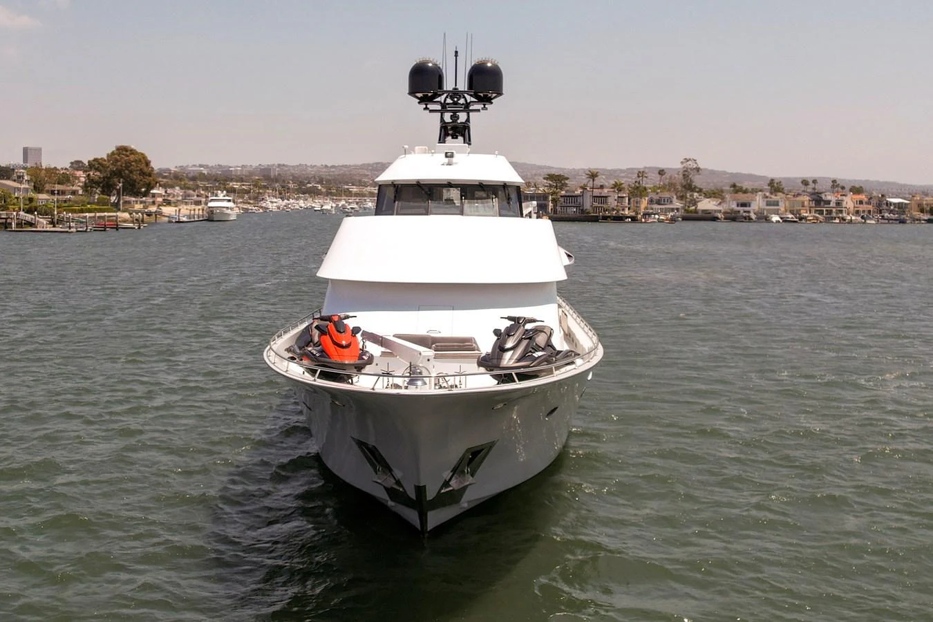 A sleek yacht is captured head-on, showcasing its modern design and equipment on the bow. aboard GOLDEN BOY II Yacht for Sale