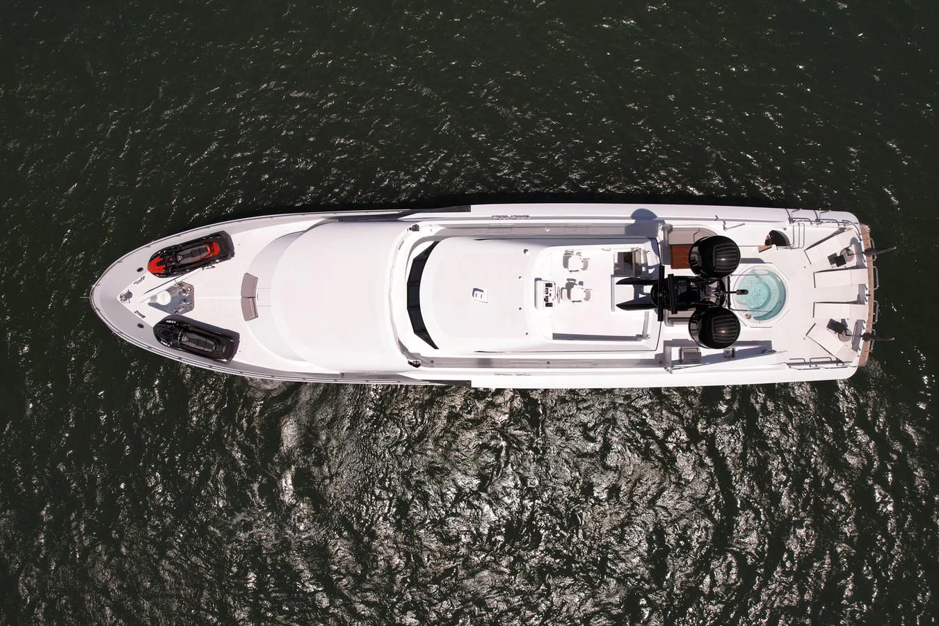 Aerial view of a sleek yacht cruising on the water, showcasing its spacious deck and luxurious amenities. aboard GOLDEN BOY II Yacht for Sale