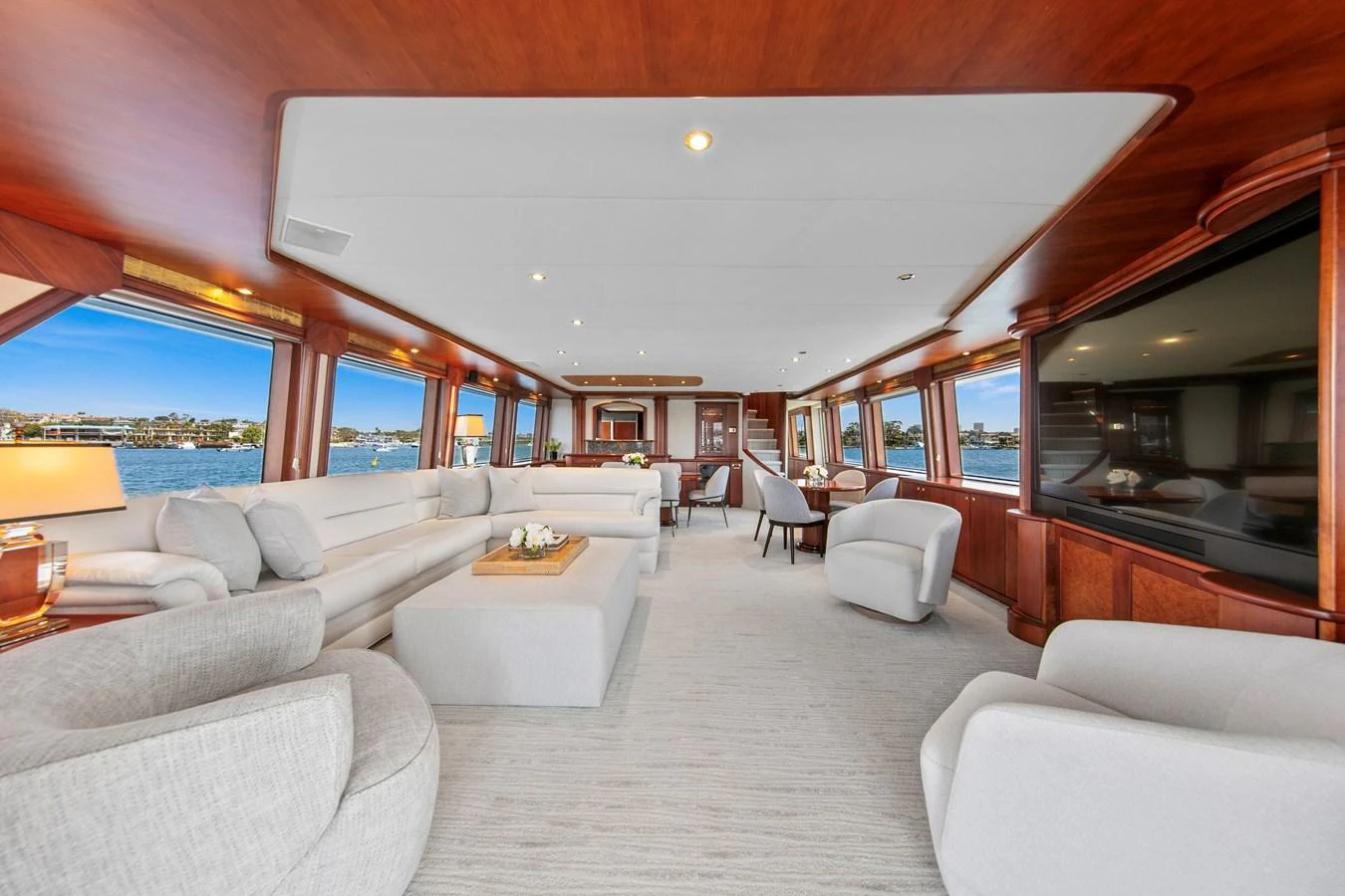 The spacious salon features elegant seating and panoramic windows offering stunning views. aboard GOLDEN BOY II Yacht for Sale