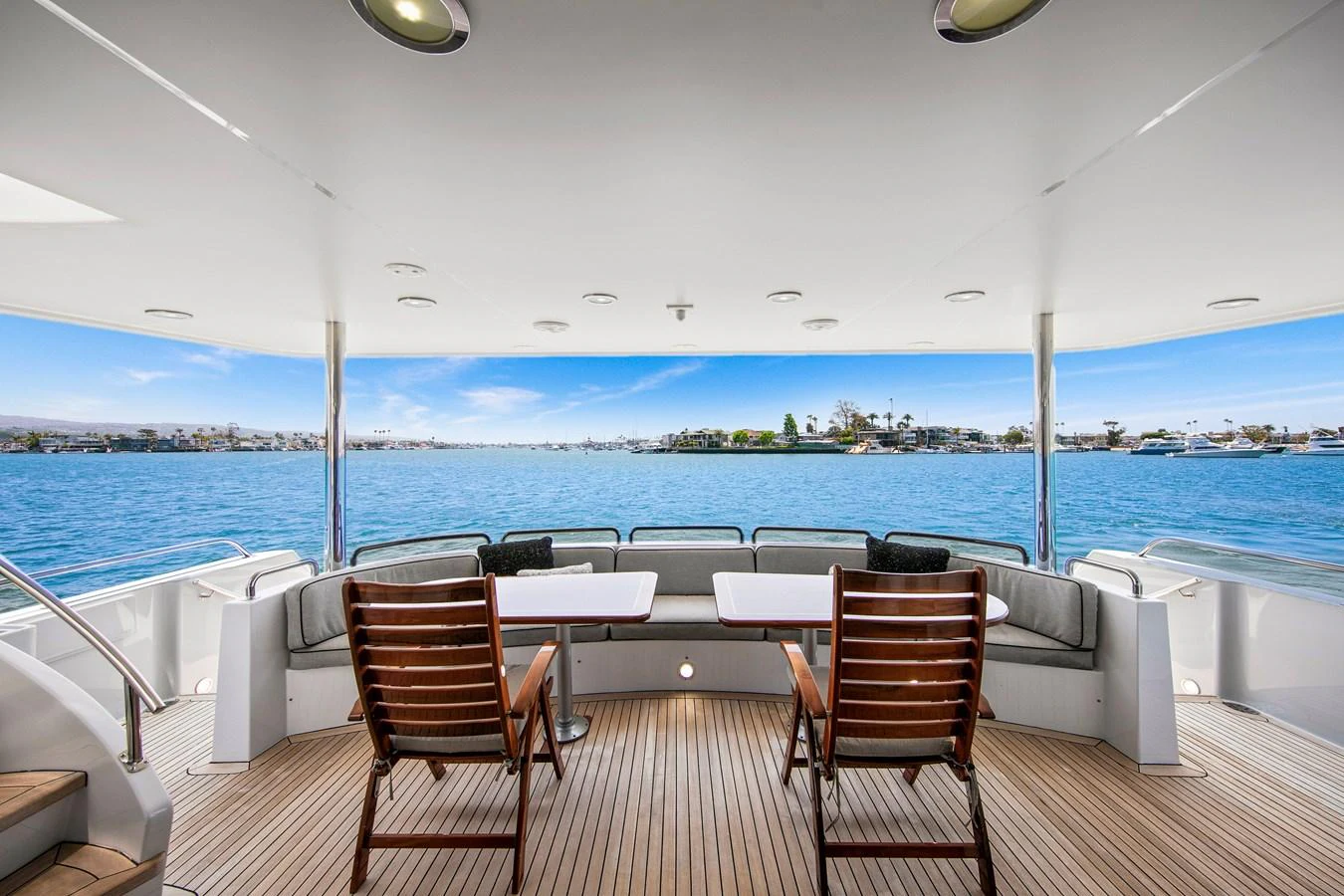The aft deck offers a serene seating area with a stunning view of the water. aboard GOLDEN BOY II Yacht for Sale